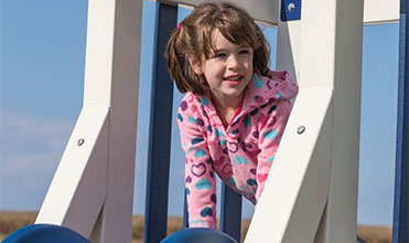 girl outside playing an imagination game like hide-and-seek girl outside playing an imagination game like hide-and-seek