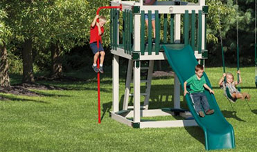 boy using fireman's pole swing set accessory  fireman's pole swing set accessory