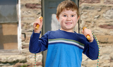 boy jumping rope for a family activity boy jumping rope