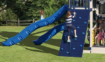 girl climbing on swing set rock wall rock wall swing set accessory