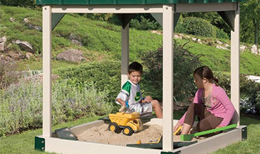 kids playing in a covered sandbox next to swing set covered sandbox swing set accessory