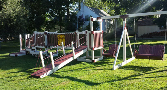 unique ground level play set with loveseat swings and tic-tac-toe game set with unique ways to play