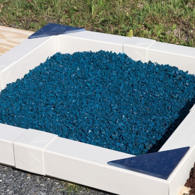 blue rubber mulch adding a pop of color to backyard playground blue rubber mulch